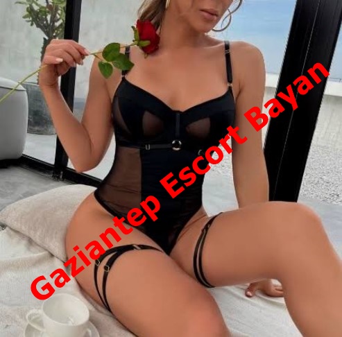 Woman in black lingerie posing indoors with a rose; red 'Gaziantep Escort Bayan' watermark across the image.