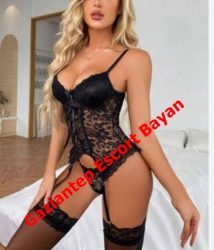 Woman in black lace lingerie posing in a bedroom, with a red watermark reading 'GaziAntep Escort Bayan' across the image.