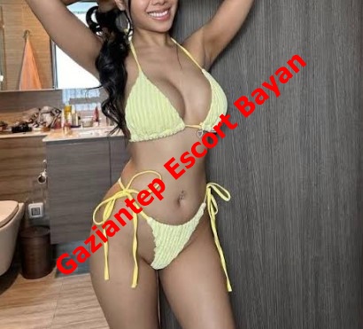 Woman in a yellow bikini posing indoors with bold red diagonal text 'Gaziantep Escort Bayan' across her torso.