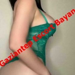 Side view of a person wearing a green lingerie bodysuit, with diagonal watermark text reading 'Gaziantep Escort Bayan'.