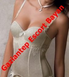 Woman in beige lace lingerie corset, cropped at the torso, with a red diagonal watermark that says 'Gaziantep Escort Bayan'.