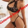 Woman in black lace lingerie posing in a bedroom with bold red text across the image reading 'Gaziantep Escort Bayan' Woman in black lace lingerie posing in a bedroom with bold red text across the image reading 'Gaziantep Escort Bayan'
